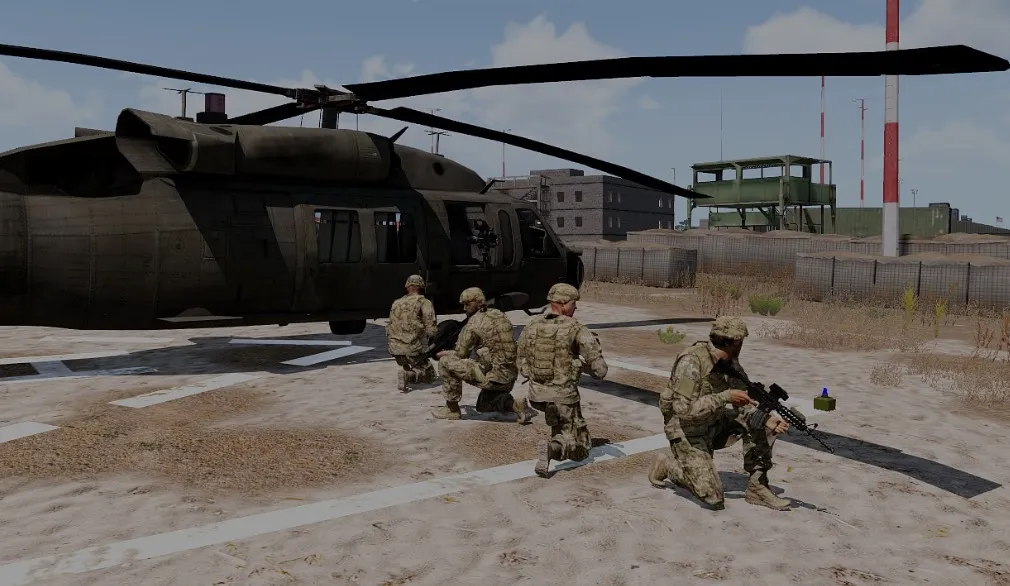Equipo esperando junto a un helicóptero