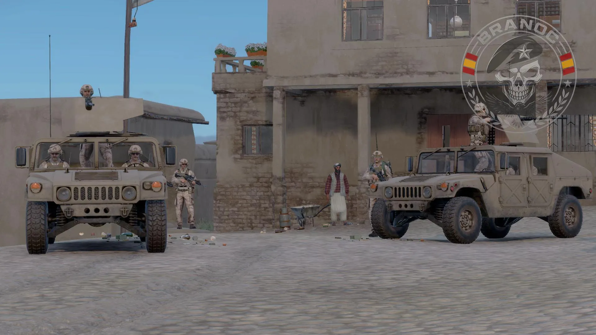 Vehículos Humvee en una población